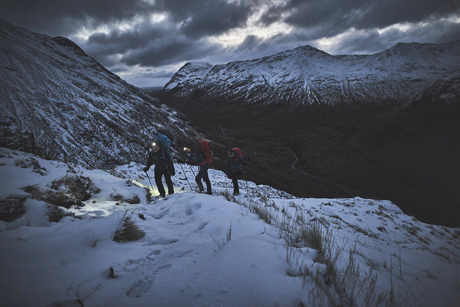 Three people night walking in Glen Coe