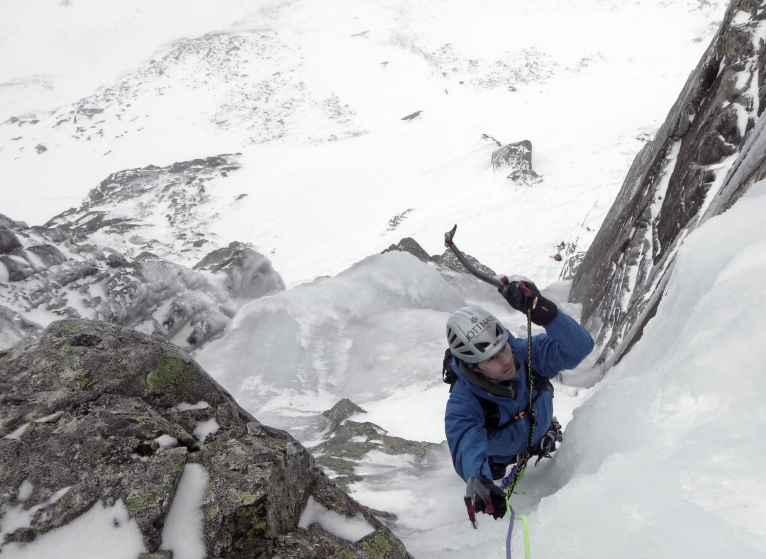 A climber on a steep ice pitch on Gemini