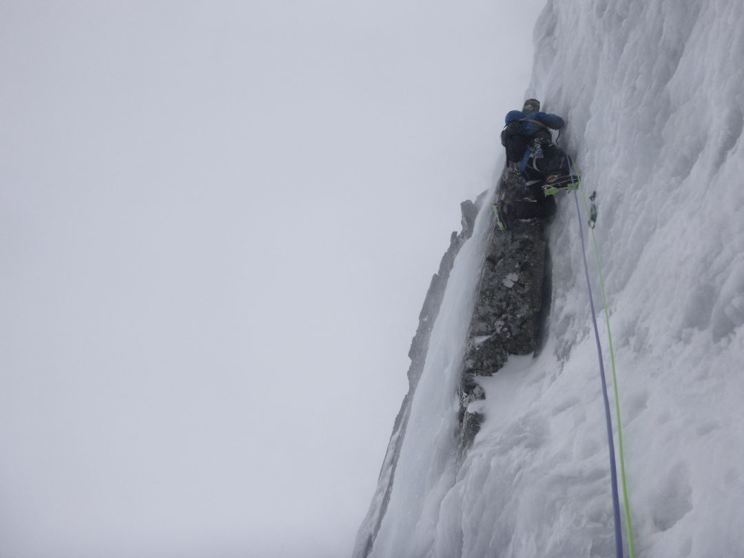 A climber leading steep water ice